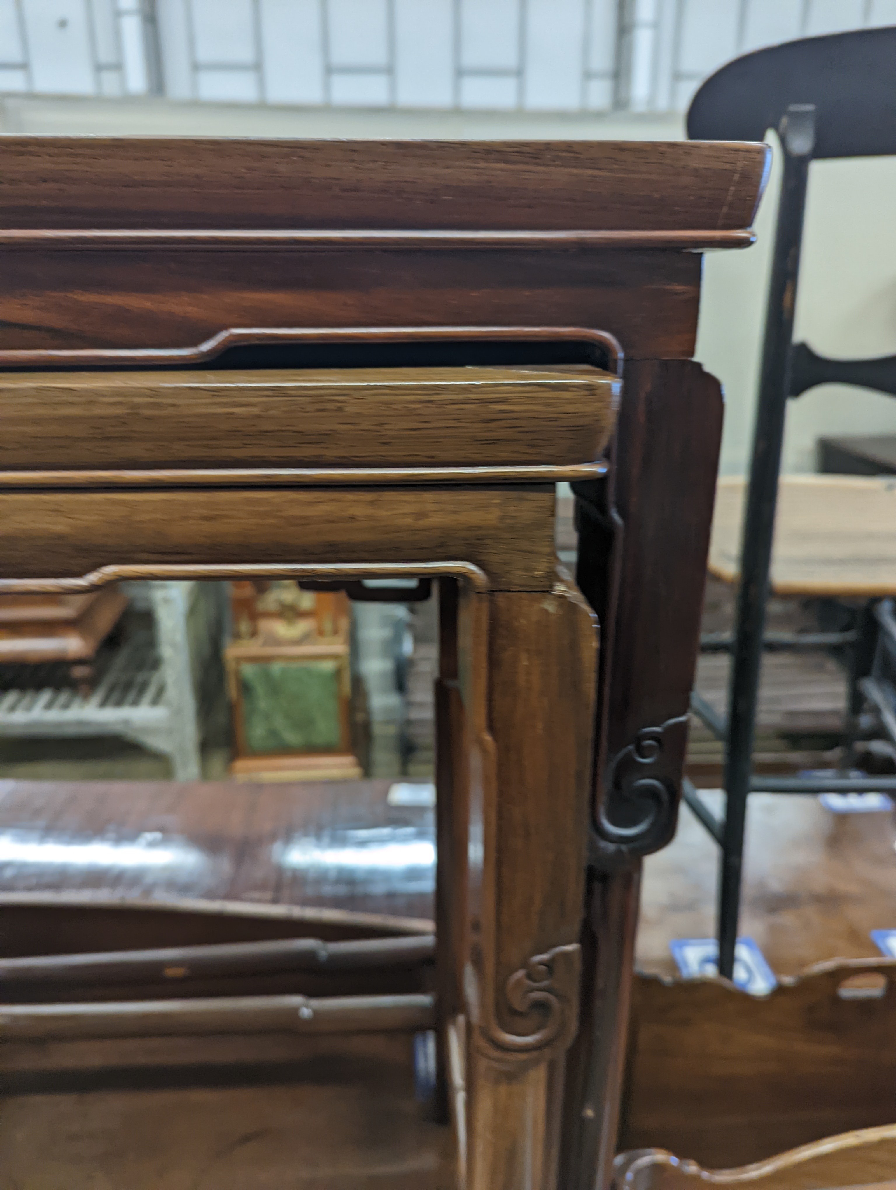 A nest of three Chinese rectangular tea tables, width 61cm, depth 36cm, height 66cm